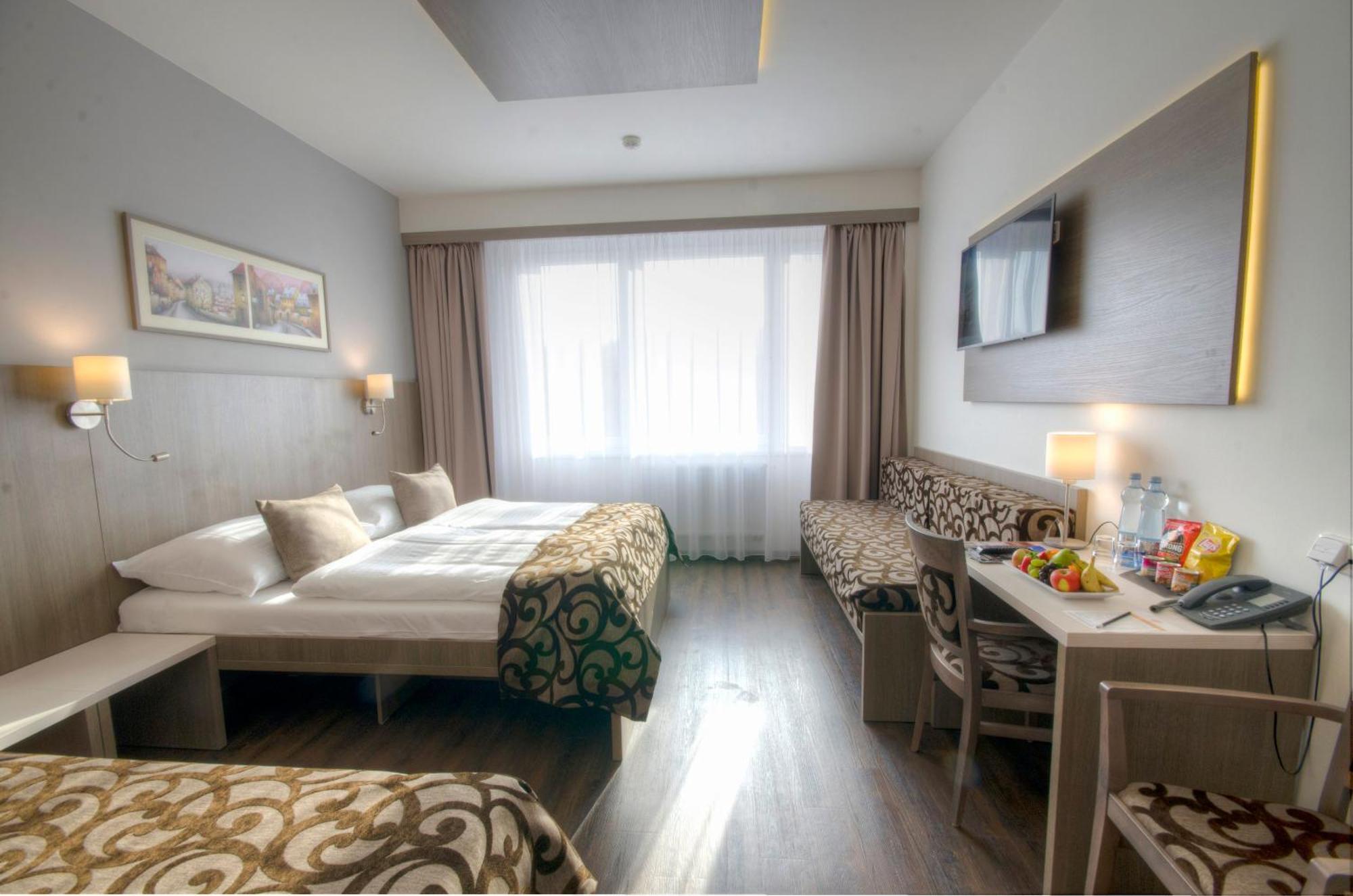 Deluxe Dreibettzimmer mit Zugang zur Wasser- und Saunawelt